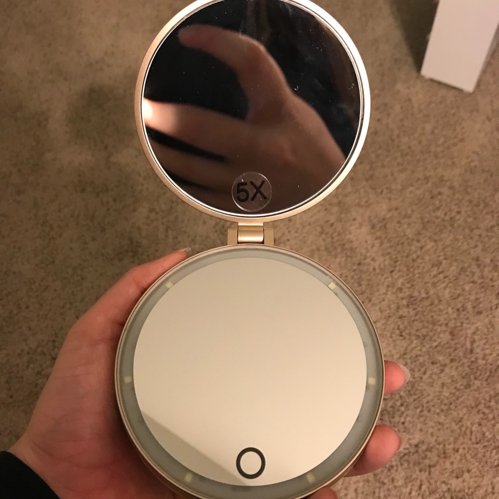 Compact mirror with magnified lenses and lighting!